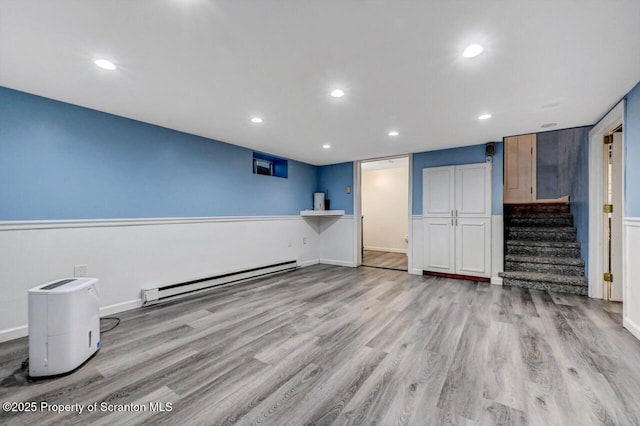 211 Hill St, Dupont, PA 18641 - unfurnished living room with a baseboard radiator, stairs, wood finished floors, and recessed lighting