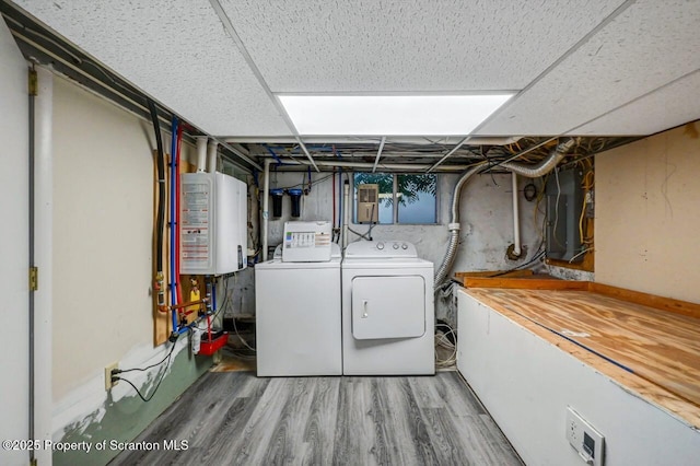 211 Hill St, Dupont, PA 18641 - laundry room featuring water heater, washer and dryer, electric panel, and wood finished floors