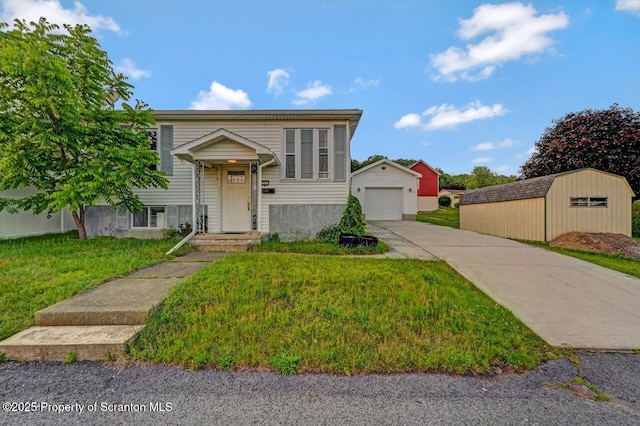 211 Hill St, Dupont, PA 18641 - raised ranch featuring concrete driveway, an outbuilding, a garage, and a front yard