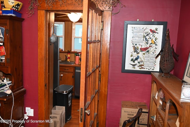 hallway featuring a sink