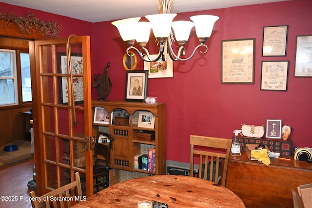 dining space featuring a chandelier