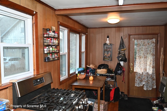 dining area featuring wood walls