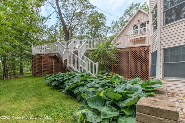 72 Adams Dr, Waymart, PA 18472 - view of green lawn with a deck and stairs