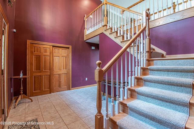 72 Adams Dr, Waymart, PA 18472 - foyer featuring stairs, tile patterned floors, and a high ceiling
