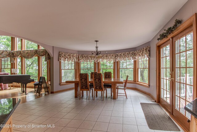 72 Adams Dr, Waymart, PA 18472 - dining space with light tile patterned floors and a chandelier