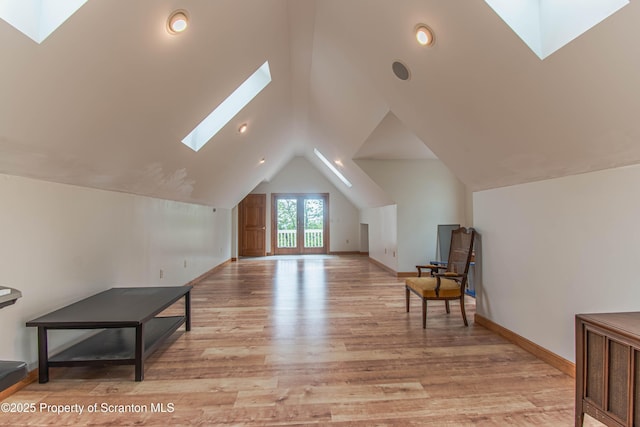 72 Adams Dr, Waymart, PA 18472 - additional living space with a skylight, vaulted ceiling, and light wood-type flooring