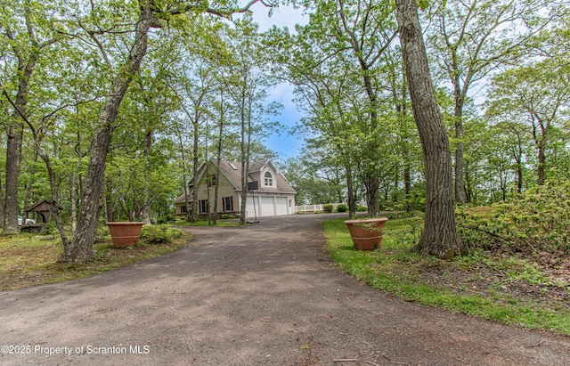 72 Adams Dr, Waymart, PA 18472 - view of front of house featuring driveway and a garage