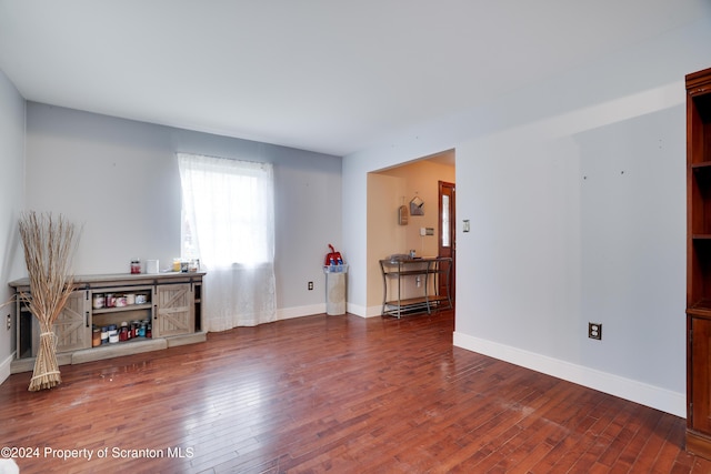 living room with dark hardwood / wood-style flooring