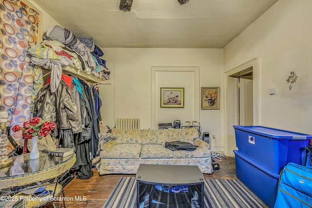 167 S Hyde Park Ave, Scranton, PA 18504 - living area featuring radiator heating unit, a textured ceiling, and wood finished floors