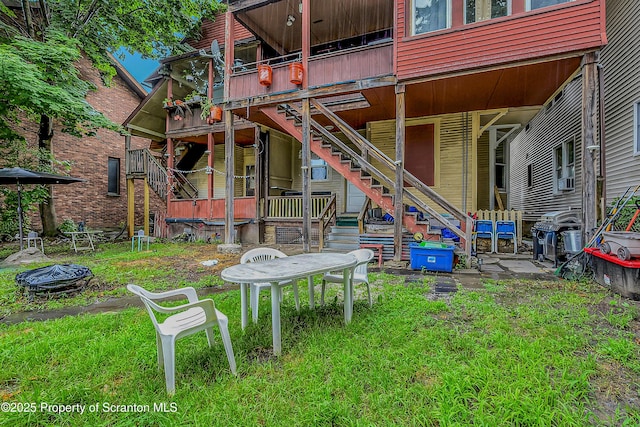 167 S Hyde Park Ave, Scranton, PA 18504 - rear view of property featuring stairs, a wooden deck, and a fire pit
