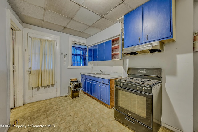 167 S Hyde Park Ave, Scranton, PA 18504 - kitchen with black gas range, blue cabinetry, under cabinet range hood, light floors, and open shelves