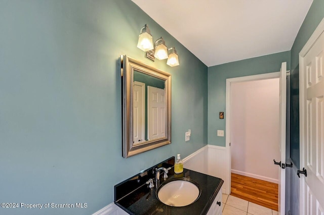 bathroom with tile patterned flooring and vanity