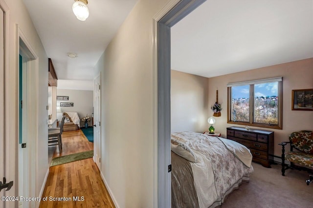 bedroom with light hardwood / wood-style flooring