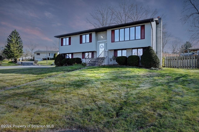 split foyer home with a lawn