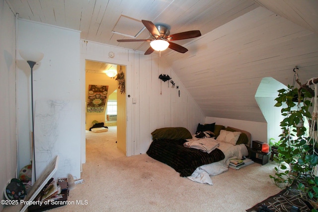 525 N Abington Rd, Waverly Twp, PA 18411 - carpeted bedroom with lofted ceiling, wooden ceiling, wood walls, and ceiling fan