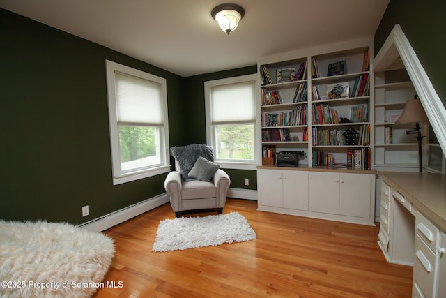 525 N Abington Rd, Waverly Twp, PA 18411 - living area with baseboard heating, light wood-style floors, and baseboards