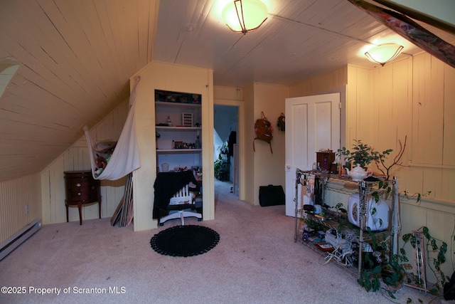 525 N Abington Rd, Waverly Twp, PA 18411 - bonus room featuring lofted ceiling, a baseboard heating unit, carpet flooring, and wooden walls