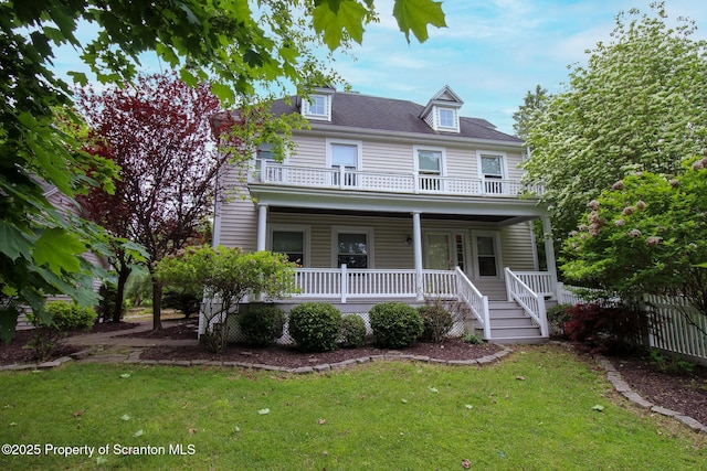525 N Abington Rd, Waverly Twp, PA 18411 - view of front of home with covered porch, a balcony, and a front yard