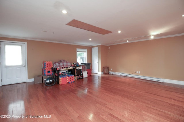 525 N Abington Rd, Waverly Twp, PA 18411 - below grade area featuring ornamental molding, wood finished floors, baseboards, recessed lighting, and a baseboard radiator