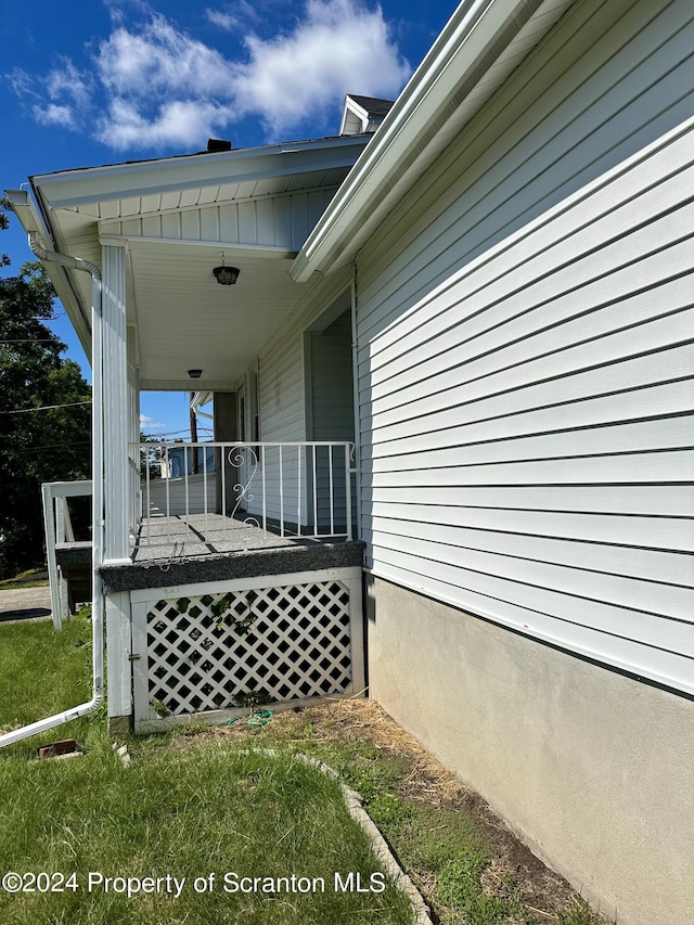 view of property exterior with a porch