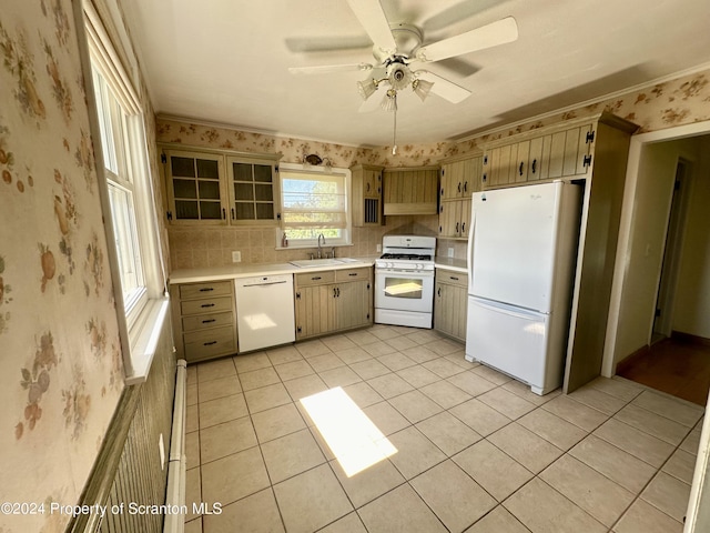 kitchen featuring white appliances, crown molding, sink, ceiling fan, and light tile patterned floors