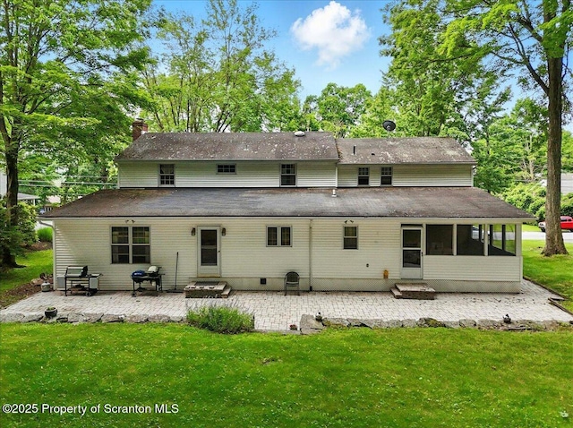 104 Sturbridge Rd, Clarks Summit, PA 18411 - rear view of property with a patio, a lawn, a sunroom, a chimney, and entry steps