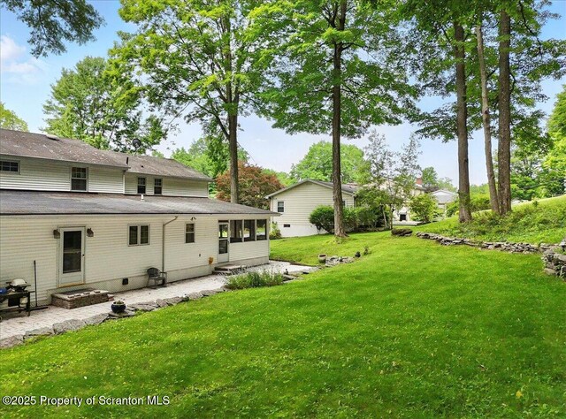 104 Sturbridge Rd, Clarks Summit, PA 18411 - view of green lawn with a patio area and a sunroom