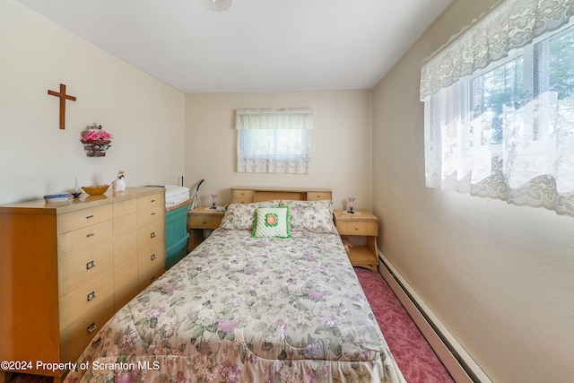 bedroom with a baseboard heating unit