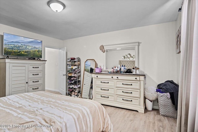 bedroom with light wood-type flooring