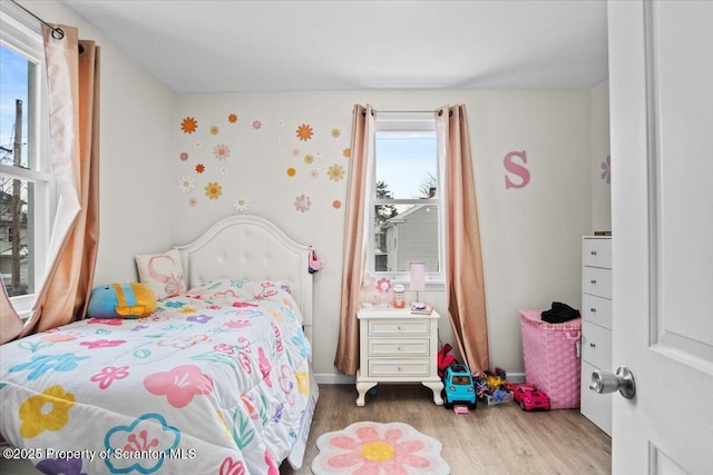 bedroom with wood-type flooring