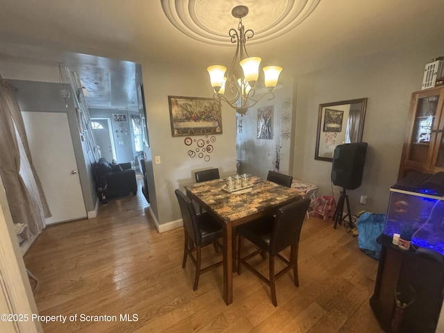 1008 Crown Ave, Scranton, PA 18505 - dining space with light wood-style floors and a chandelier