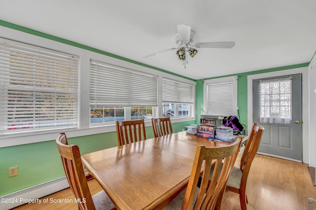 dining room with ceiling fan, light hardwood / wood-style flooring, and a baseboard radiator