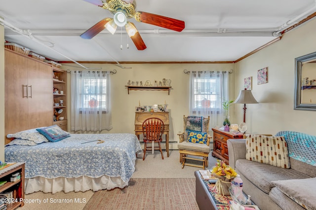 bedroom with ceiling fan, light carpet, and a baseboard radiator