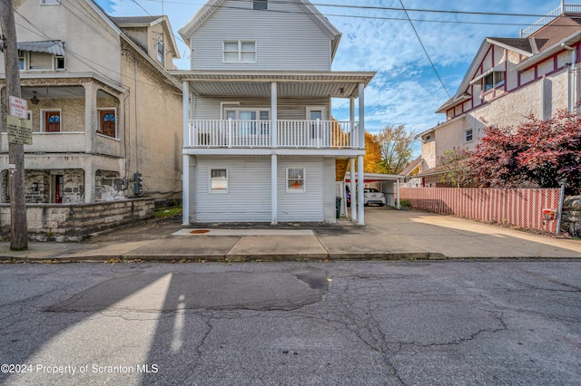 view of front of home with a balcony