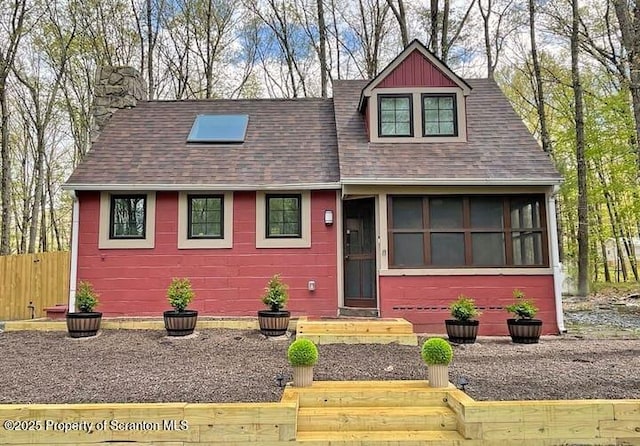 view of front of home with a sunroom