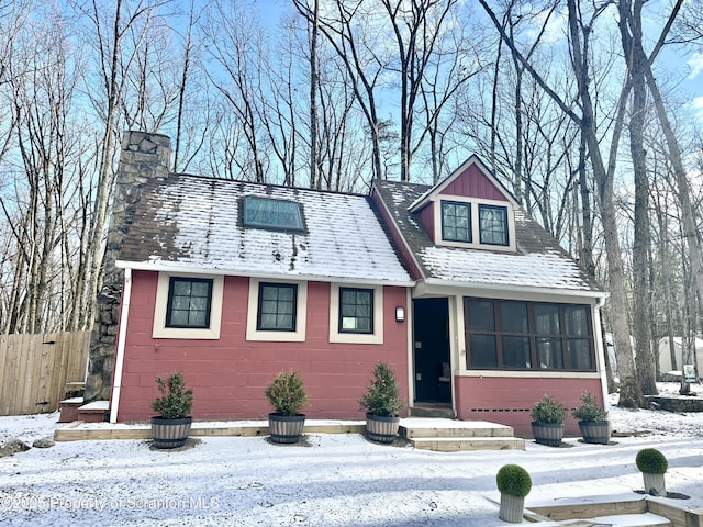 view of front of home featuring a sunroom