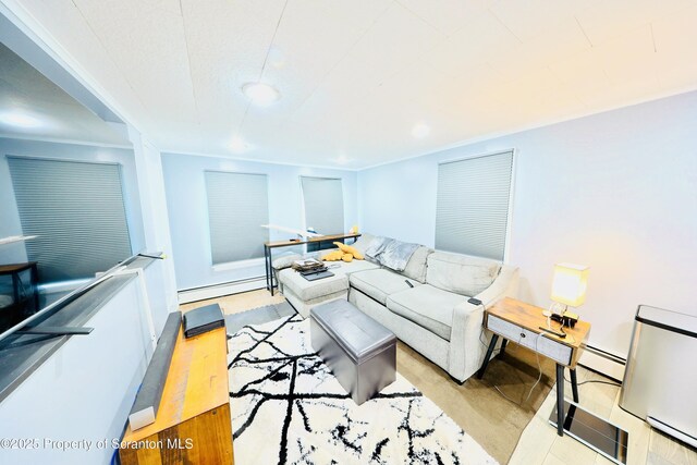 living area featuring recessed lighting and a baseboard radiator