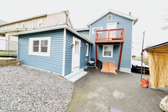 back of house with a patio area