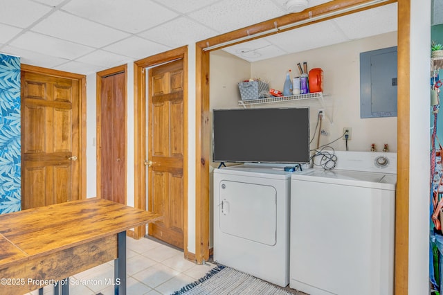 washroom featuring light tile patterned floors, electric panel, and independent washer and dryer