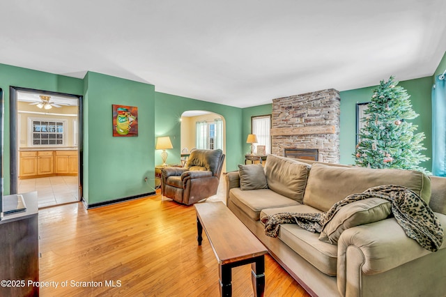 living room with a fireplace and light hardwood / wood-style flooring