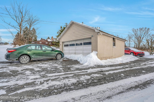 view of snow covered garage