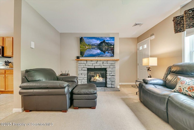 1029 Bear Trail Rd, Lake Ariel, PA 18436 - carpeted living room featuring baseboards and a stone fireplace