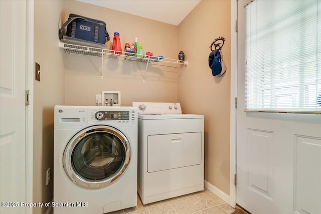 1029 Bear Trail Rd, Lake Ariel, PA 18436 - laundry room featuring washing machine and clothes dryer, baseboards, and light tile patterned flooring