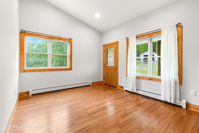 87 Old Farm Ln, White Haven, PA 18661 - foyer entrance featuring baseboard heating, light wood finished floors, lofted ceiling, baseboards, and a baseboard radiator