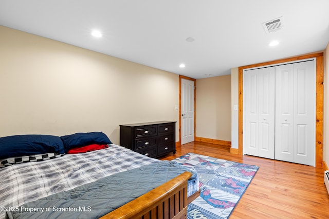 87 Old Farm Ln, White Haven, PA 18661 - bedroom with light wood finished floors, recessed lighting, baseboards, a closet, and a baseboard radiator