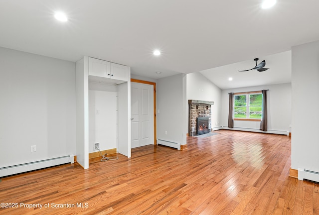 87 Old Farm Ln, White Haven, PA 18661 - unfurnished living room featuring a baseboard heating unit, light wood-style flooring, recessed lighting, a fireplace, and ceiling fan