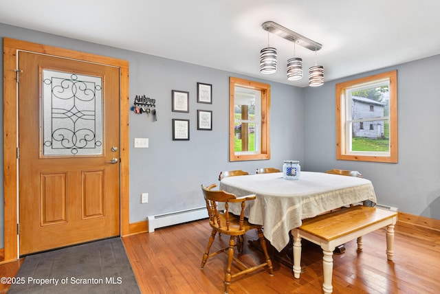 87 Old Farm Ln, White Haven, PA 18661 - dining area featuring hardwood / wood-style flooring, a baseboard heating unit, and baseboards