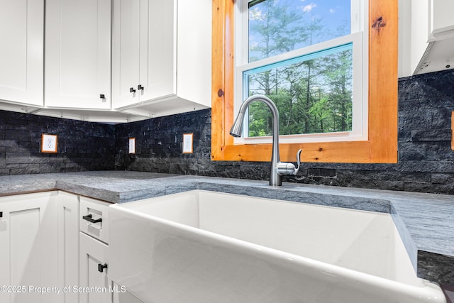 87 Old Farm Ln, White Haven, PA 18661 - kitchen with a sink, decorative backsplash, and white cabinetry