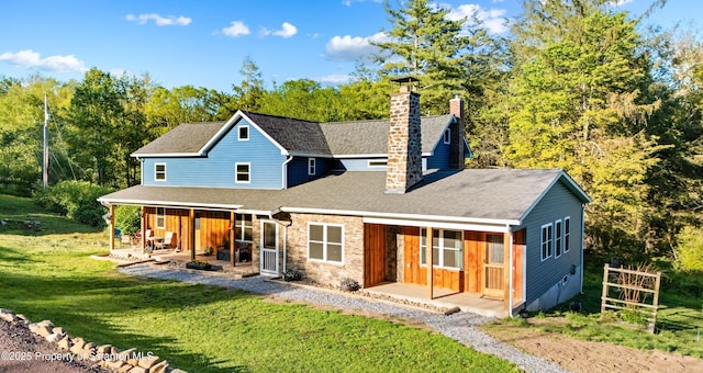 87 Old Farm Ln, White Haven, PA 18661 - rear view of house featuring a chimney, covered porch, a lawn, and a shingled roof