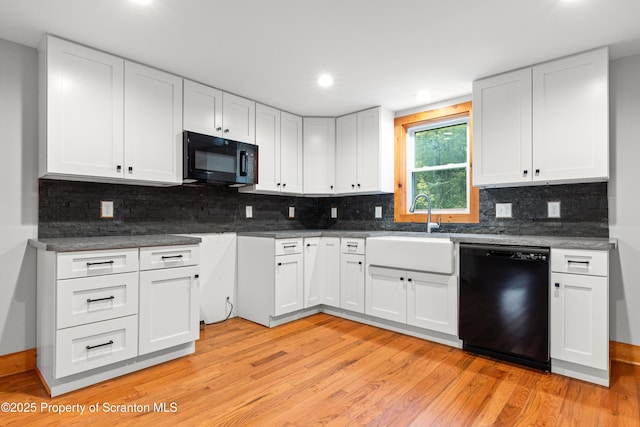 87 Old Farm Ln, White Haven, PA 18661 - kitchen featuring black appliances, a sink, light wood-type flooring, white cabinets, and recessed lighting